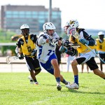 The local Angler Lacrosse Club reached the finals in their division at the prestigious Lax Splash 2014 tournament in and around the Baltimore area last weekend. Pictured above, the Angler’s Colton Edmunds closes in on a Baltimore Club player during an 8-3 early round win.Photo by Owen Dawson
