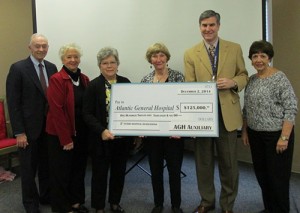 AGH Auxiliary Executive Committee Members Present Check For $125,000 To President And CEO