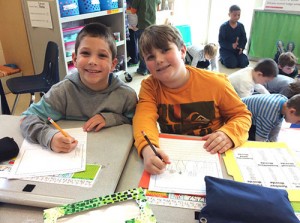 First Grade Class Works On First Non-Fiction Writing Piece