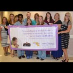 Members of the PRMC Women’s and Children’s team and executive leadership of the Medical Center proudly display the banner presented to them by the Maryland Department of Health and Mental Hygiene and the Maryland Patient Safety Center in recognition of the Peninsula Regional’s commitment to improving the quality of care of babies and mothers.