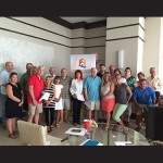 Realtors with Mark Fritschle Group-Condominium Realty are pictured at a recent sales meeting where July leaders were announced. Submitted Photos