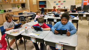 Students At OC Elementary Use iPads To Read Books And Answer Comprehensive Questions