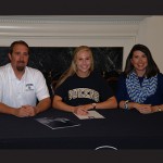 Worcester Prep field hockey standout Hanna Nechay this week signed a letter of intent to play field hockey and attend Queen’s University in North Carolina next year. Pictured above is Hanna (center) with dad Frank (left) and mom Kim (right). Photo by Shawn Soper 