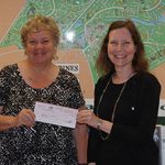 Marie Gilmore, president of the Worcester County Veterans Memorial Foundation, was presented a check by Ocean Pines Association Department of Marketing and Public Relations representative Julie Malinowski, representing the proceeds of a partnership between the OPA and BJ’s Wholesale. Photo by OPA