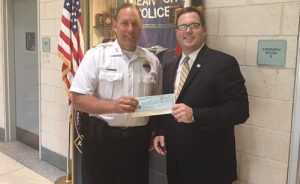 Attorney Brian H. Clark Presents $2,000 Check To OC Police