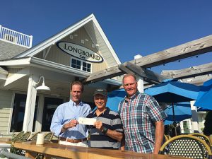 Ocean City Surf Club Receives Donation From Longboard Café