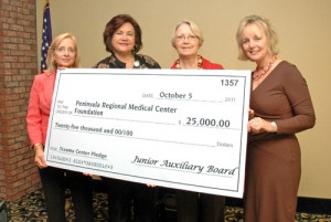 Junior Auxiliary Board at PRMC Present PRMC Foundation With $25,000 Check