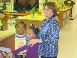 Media Specialist Helps Buckingham Elementary Students Check Out Books