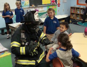 OC Firefighter Shows Kindergarteners Not To Be Afraid Of Firefighters Dressed In Full Gear