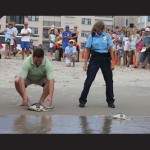 Ocean City Councilman Wayne Hartman and Animal Control Officer Barbara Wisniewski are pictured releasing two of the turtles. Photos courtesy of National Aquarium 