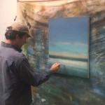 Artist Kevin Fitzgerald is pictured putting the finishing touches on his painting, “Morning Wave,” which will be auctioned at the Jan. 9 benefit. Submitted Photo
