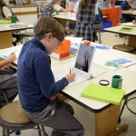 Fifth grader Parker Tingle works with an iPad and the Osmo program in the lower school art room.