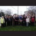 Pictured at last month’s ribbon cutting for the rebranded Bishop-Hastings Funeral Home are, front from left, Nancy Hoeflich, Harry Hammond, Sonia Baker, Sandra Schlesinger, Carrie Hudson, Mayor Clifton Murray, Wyatt Bishop, Amy Bishop, W. Bryan Bishop, Jr., Bry Bishop, Peggy Bishop, Representative Ron Gray and Louise Lynch; and, back from left, Kristie Maravalli, Veronica Bona, Richard Mais, Sue Nilsson, Lisa Nugent and David Hedges.
