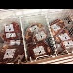 A frozen foods section includes a variety of meats fresh from Hudson’s own Romarlan Farm.