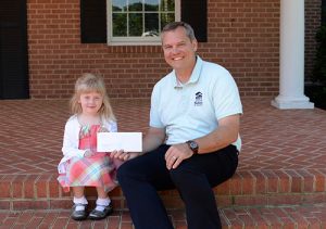 Worcester Prep Pre-Kindergartener Vivian Spraul Presents $520 Check To Habitat For Humanity