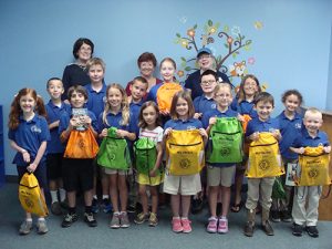 Students From Seaside Christian Academy Receive Reading Books And Book Bags From McGuffey Bookworm Club