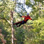Eighth grader T.J. Bescak is pictured on a zip line course during his class field trip.