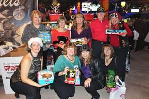 Coastal Association Of REALTORS® Collect Over 100 Toys For Toys For Tots And Raises $275 For Habitat For Humanity