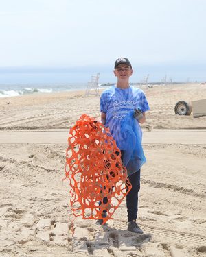 School Partners With Surfrider For OC Beach Cleanup