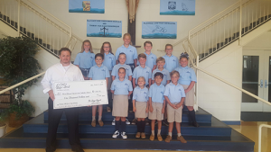 Most Blessed Sacrament Catholic School Receives Check From de Lazy Lizard