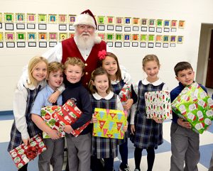 Lower School Students Line Up To Visit Santa And Give Gifts To Those In Need At Diakonia