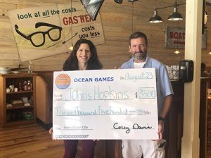 Swim Ocean City Presents Donation To Hopkins Program