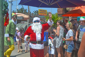 Fish Tales Welcomes Santa, Decorates For Christmas In July